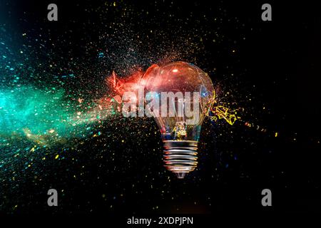 real image Light bulb  exploding colorful powder black background creativity concept Stock Photo