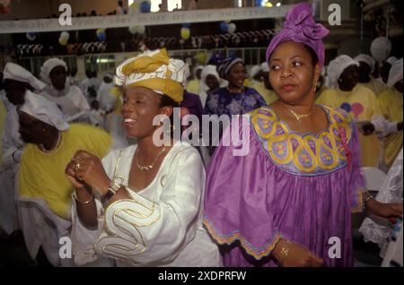 Yoruba UK. Celestial Church of Christ people from western Nigeria celebrate their Harvest Festival in south London. A group of women spiritual dancing, a celebration of faith. Elephant and Castle, London, England, 12th September 1993 1990s UK HOMER SYKES. Stock Photo