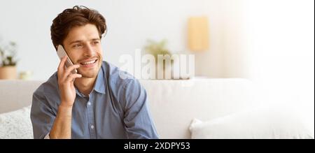 Man Talking on Phone on Couch Stock Photo