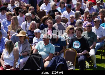 People wait for a speech by Reform UK leader Nigel Farage at the Mercure Maidstone Great Danes Hotel in Maidstone Kent. Picture date: Monday June 24, 2024. Stock Photo