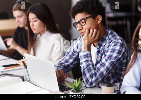 Young Students Engaged in Learning at Classroom During School Hours Stock Photo