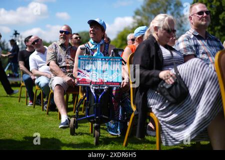 People wait for a speech by Reform UK leader Nigel Farage at the Mercure Maidstone Great Danes Hotel in Maidstone Kent. Picture date: Monday June 24, 2024. Stock Photo