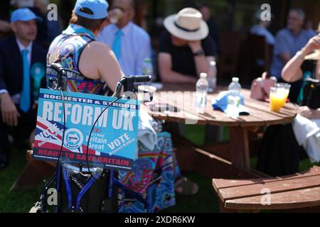 People wait for a speech by Reform UK leader Nigel Farage at the Mercure Maidstone Great Danes Hotel in Maidstone Kent. Picture date: Monday June 24, 2024. Stock Photo