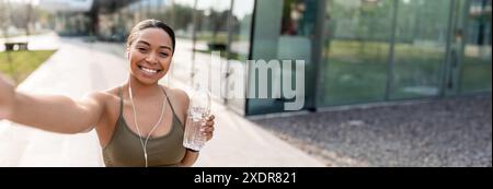 African American woman taking selfie with cellphone Stock Photo