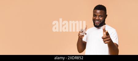 Happy African American Man Pointing At Camera Stock Photo