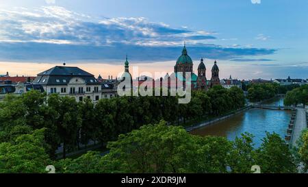 Beautiful evening viwe of Isar river and Sankt Lukas church in Munich, Germany Sankt Lukas at Isar river in an aerial view Munich Germany *** Schöner Stock Photo