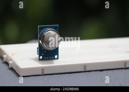 Gas sensor or known by the name MQ2 sensor that can detect the leakage of liquid petroleum gas is placed on a breadboard Stock Photo