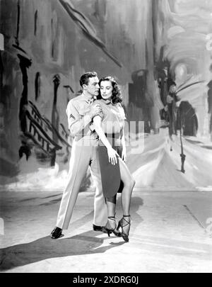 GENE KELLY and TAMARA TOUMANOVA in Ring Around The Rosy segment in INVITATION TO THE DANCE 1956 director / choreographer GENE KELLY costume designer Rolf Gerard producer Arthur Freed Metro Goldwyn Mayer (MGM) Stock Photo