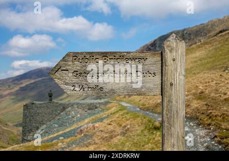 Close up of wooden public bridleway sign to Gatesgarth at Honister Slate Mine Lake District National Park Cumbria England UK United Kingdom GB Stock Photo