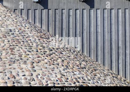 metal vertical wall with stone masonry texture background Stock Photo