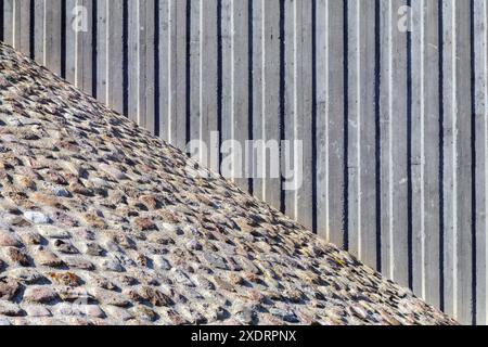 metal vertical wall with stone masonry texture background Stock Photo