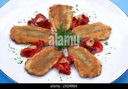 Fried anchovies stuffed with Piquillo peppers. Cuisine School Luis Irizar. Donostia-San Sebastian, Gipuzkoa. Euskadi. Spain. / Anchoas rellenas de Pim Stock Photo