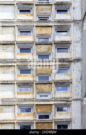 detail of reinforced concrete building wall with small windows Stock Photo