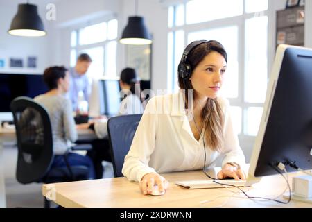 Young executives working in office. Advertising agency. Stock Photo