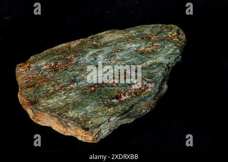 A sample of bright apple-green chlorite schist against a black background Stock Photo