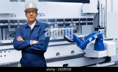 Engineer with robots in a smart factory. Smart industry 4.0 concept. Stock Photo