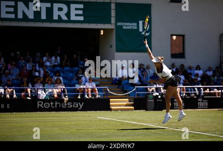 Eastbourne, East Sussex, UK. 24th June 2024; Devonshire Park, Eastbourne, East Sussex, England: Rothesay International Eastbourne, Day 1, Anastasia Pavlyuchenkova serves to Magda Linette (POL), womens singles match Credit: Action Plus Sports Images/Alamy Live News Stock Photo