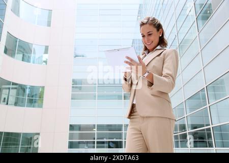 Businesswoman using digital tablet Stock Photo