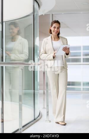 Businesswoman using digital tablet Stock Photo