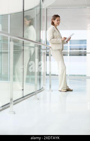 Businesswoman using digital tablet Stock Photo