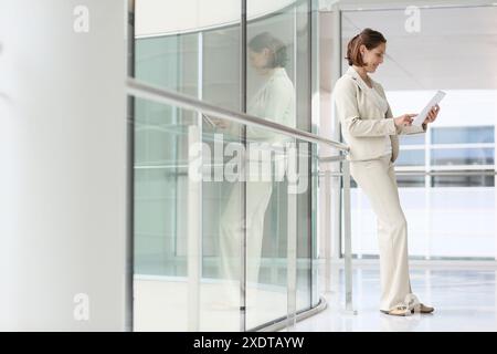 Businesswoman using digital tablet Stock Photo