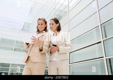 Businesswomen using digital tablet Stock Photo