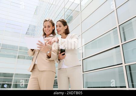 Businesswomen using digital tablet Stock Photo