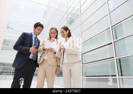 Businesspeople using digital tablet Stock Photo