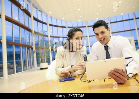Executives with digital tablet, video conference Stock Photo