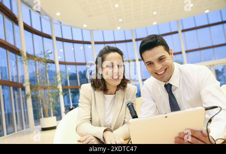 Executives with digital tablet, video conference Stock Photo