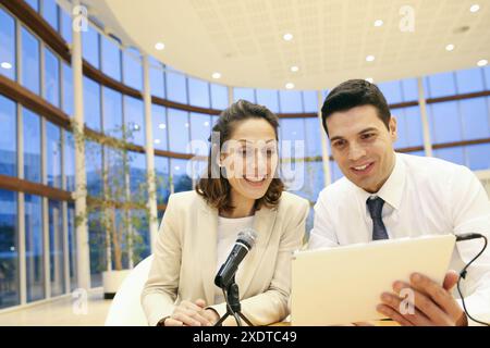 Executives with digital tablet, video conference Stock Photo