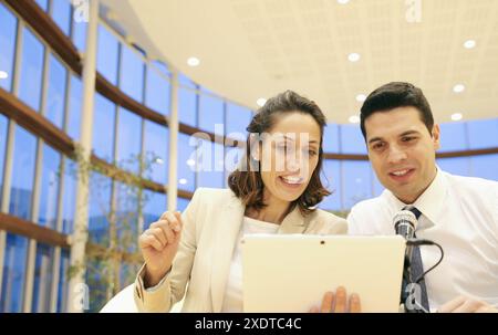 Executives with digital tablet, video conference Stock Photo