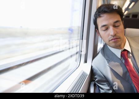 Businessman asleep. Passenger. AVE, Tren de Alta Velocidad, Zaragoza, Aragón. Spain. Stock Photo