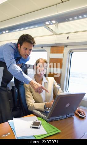 Businessmen working connected to the internet. Passenger. AVE, Tren de Alta Velocidad, Zaragoza, Aragón. Spain. Stock Photo