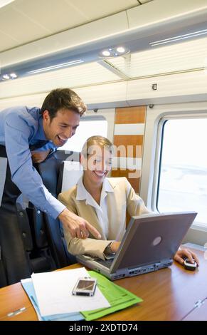 Businessmen working connected to the internet. Passenger. AVE, Tren de Alta Velocidad, Zaragoza, Aragón. Spain. Stock Photo
