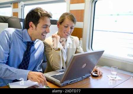 Businessmen working connected to the internet. Passenger. AVE, Tren de Alta Velocidad, Zaragoza, Aragón. Spain. Stock Photo