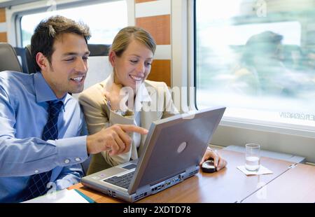 Businessmen working connected to the internet. Passenger. AVE, Tren de Alta Velocidad, Zaragoza, Aragón. Spain. Stock Photo