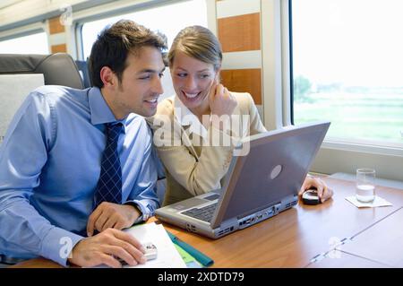 Businessmen working connected to the internet. Passenger. AVE, Tren de Alta Velocidad, Zaragoza, Aragón. Spain. Stock Photo