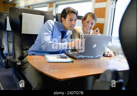 Businessmen working connected to the internet. Passenger. AVE, Tren de Alta Velocidad, Zaragoza, Aragón. Spain. Stock Photo
