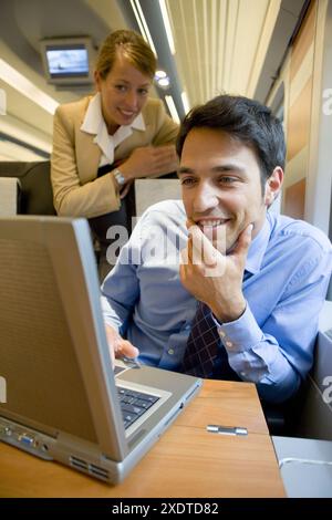 Businessmen working connected to the internet. Passenger. AVE, Tren de Alta Velocidad, Zaragoza, Aragón. Spain. Stock Photo