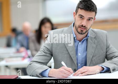 Businessman taking notes Stock Photo