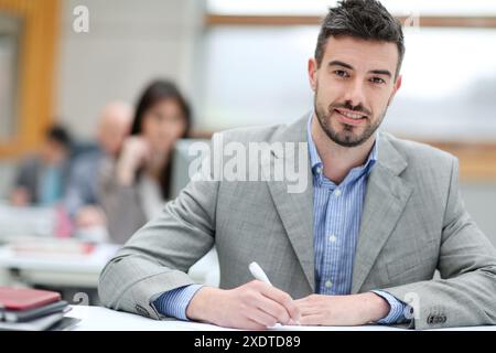 Businessman taking notes Stock Photo