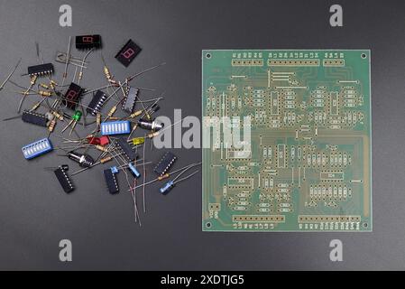Green electronic circuit board with semiconductors on black background Stock Photo