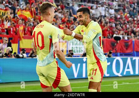 Ferran Torres celebrates a goal with Dani Olmo of FC Barcelona during