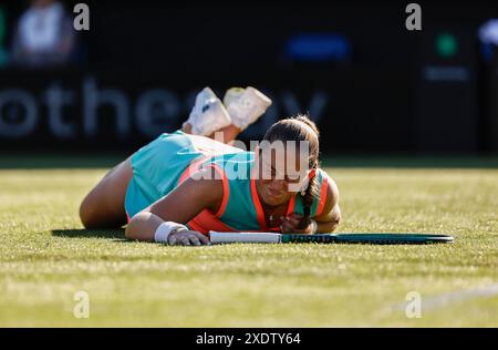 Eastbourne, East Sussex, UK. 24th June 2024; Devonshire Park, Eastbourne, East Sussex, England: Rothesay International Eastbourne, Day 1, Jelena Ostapenko (LAT) slips during the match against Greet Minnen (BEL) Credit: Action Plus Sports Images/Alamy Live News Stock Photo