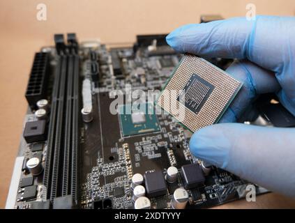 Pind of the onboard CPU and socketed CPU. Microprocessors on the computer mainboard. Selected focus. Stock Photo