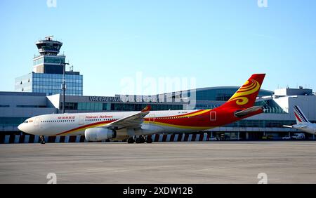 Prague, Czech Republic. 24th June, 2024. A passenger plane of Hainan Airlines arrives at the Prague Airport, Prague, the Czech Republic, on June 24, 2024. Direct flights between the capital cities of China and the Czech Republic officially resumed on Monday, with the arrival of a Hainan Airlines aircraft at the Prague Airport in the early morning after a 10-hour flight. Credit: Dana Kesnerova/Xinhua/Alamy Live News Stock Photo