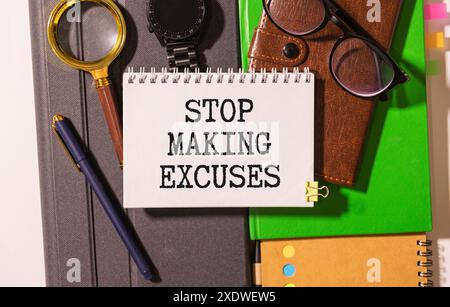 Stop Making Excuses! text on notepad on white background Stock Photo