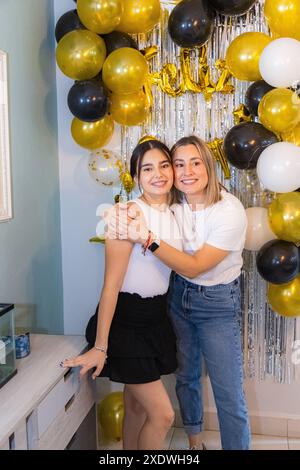 Birthday girl accompanied by her aunt Stock Photo