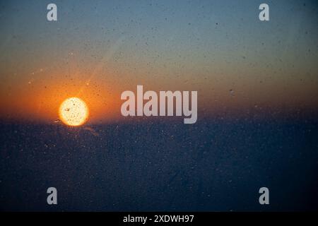 sunset through a raining window, Stock Photo
